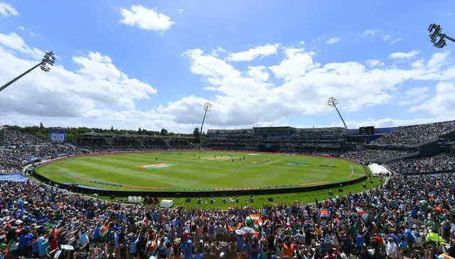 Cricket stadium full of fans watching a day match